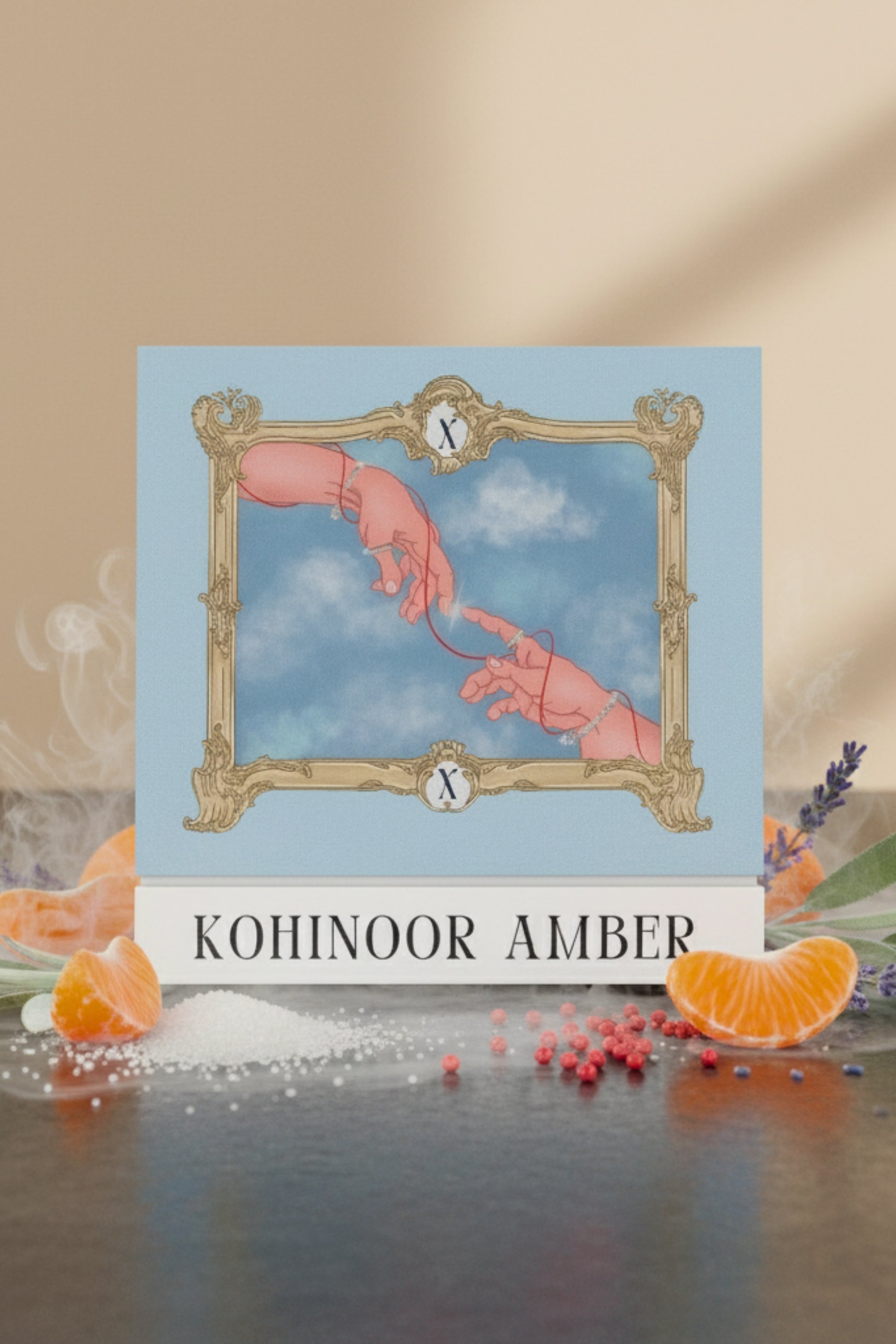 Digital art illustration on the Kohinoor Amber perfume box, depicting two hands reaching for each other and connected by a red string, framed by a baroque border under a cloudy sky. The artwork is inspired by the 'Creation of Adam' and represents connection and luxury. Product features the XAZINA brand name.