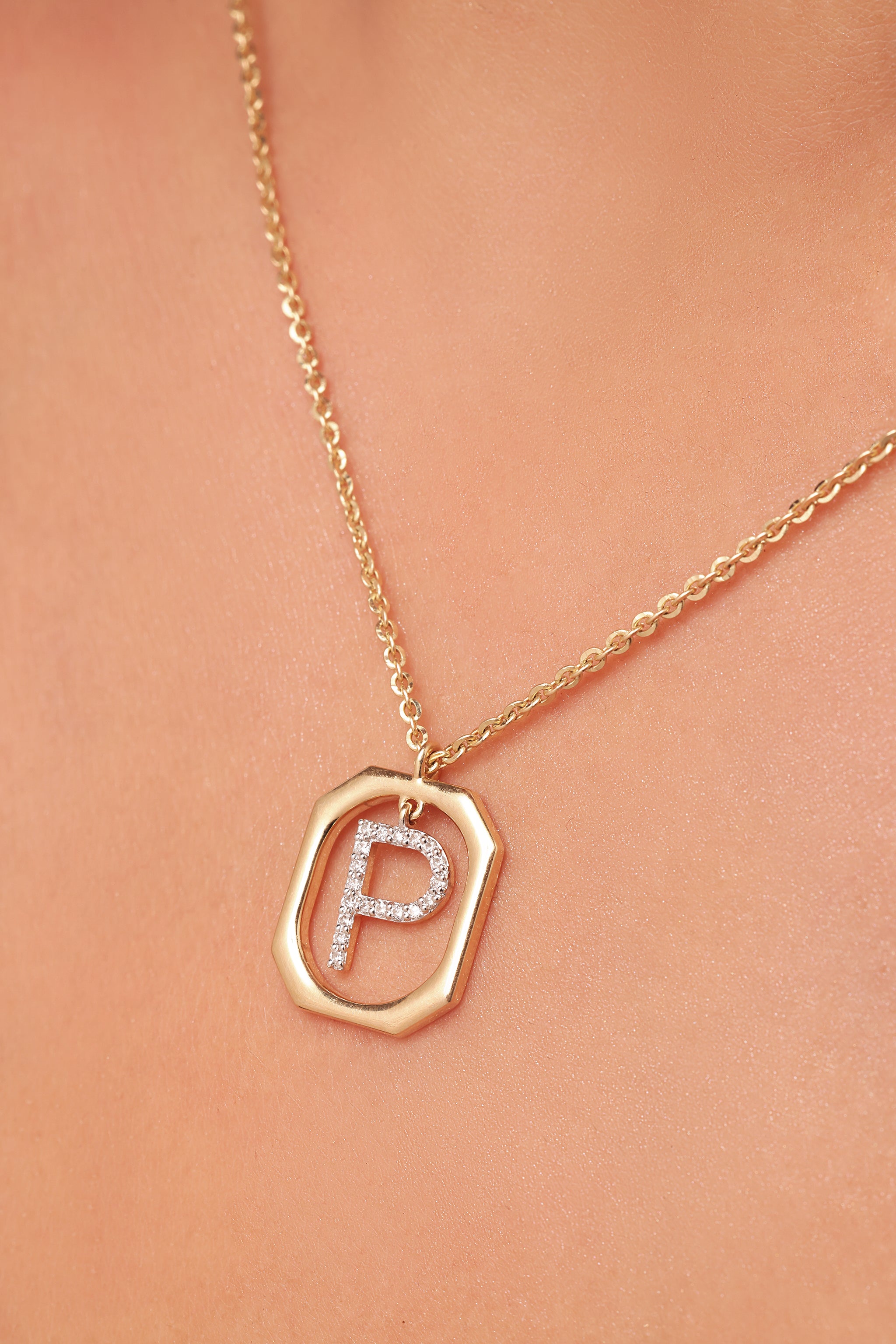 Diamond studded alphabet pendant