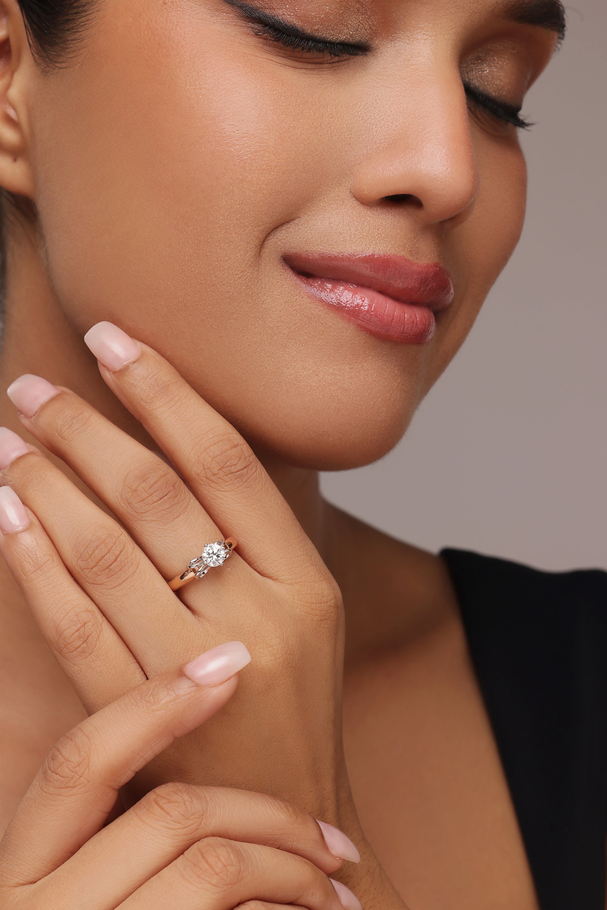 Round Solitaire Ring with Tapered Bow Shoulders