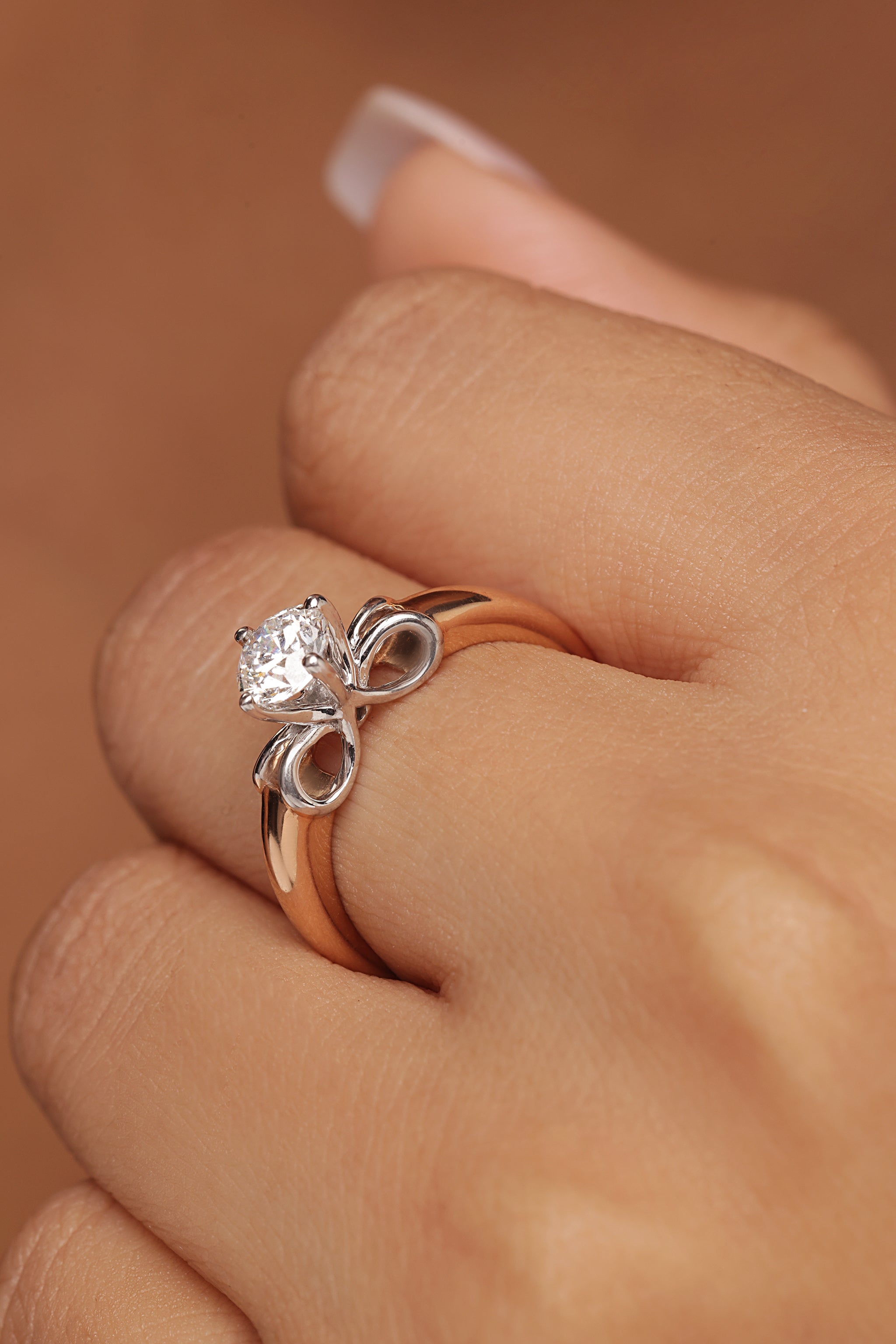 Round Solitaire Ring with Tapered Bow Shoulders
