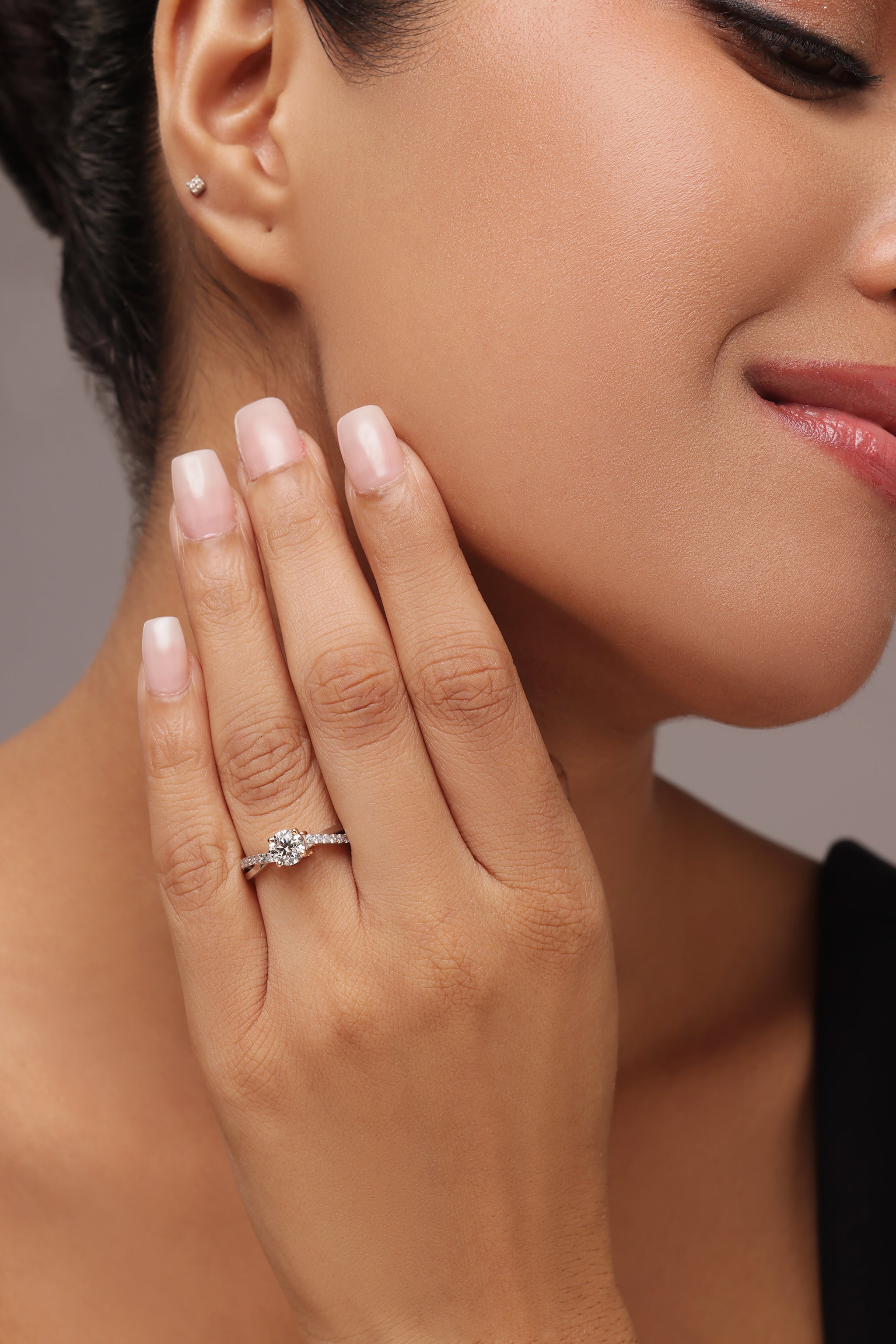 Round Diamond Ring with Tapered Bow Shoulders