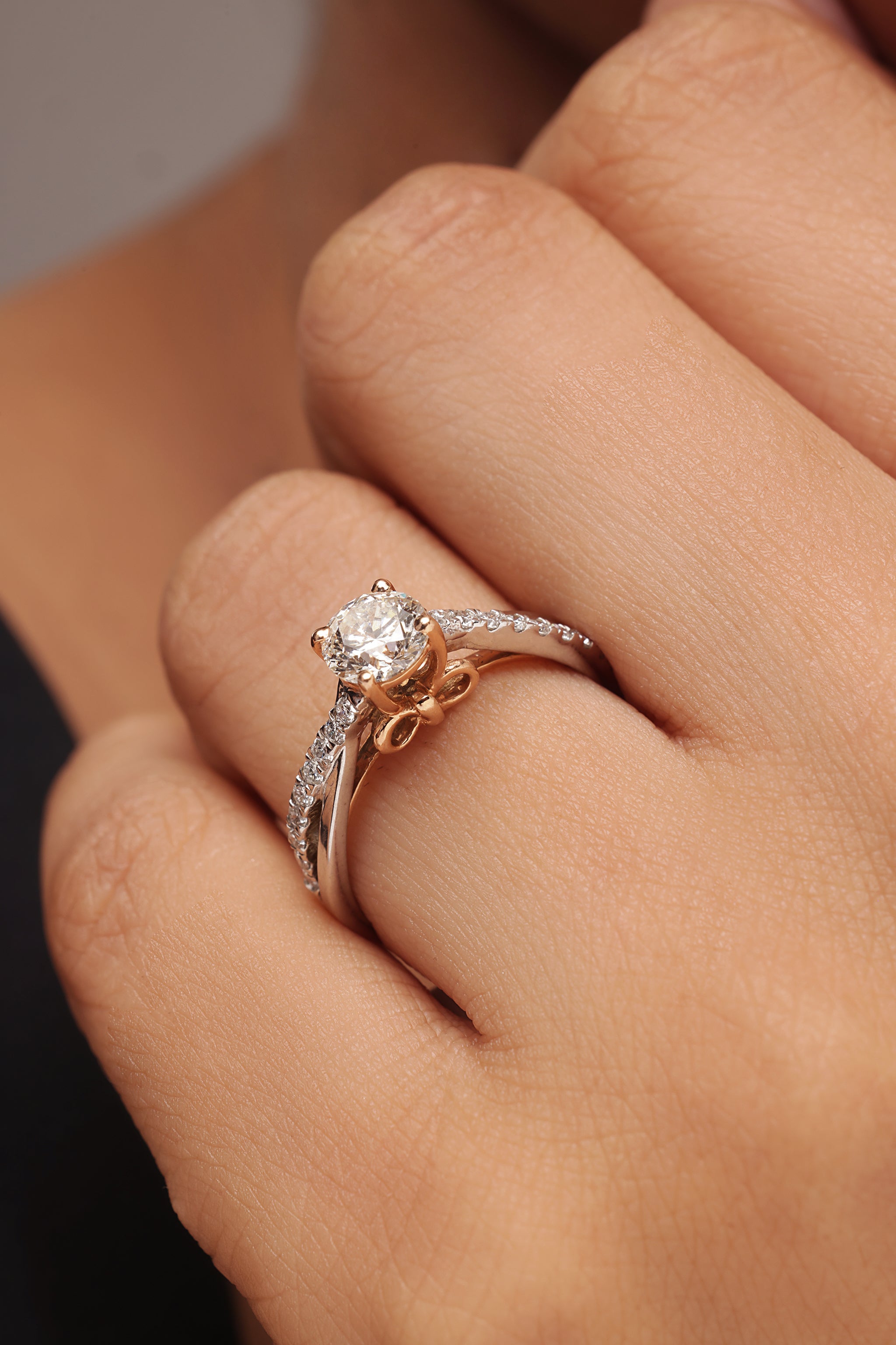 Round Diamond Ring with Tapered Bow Shoulders