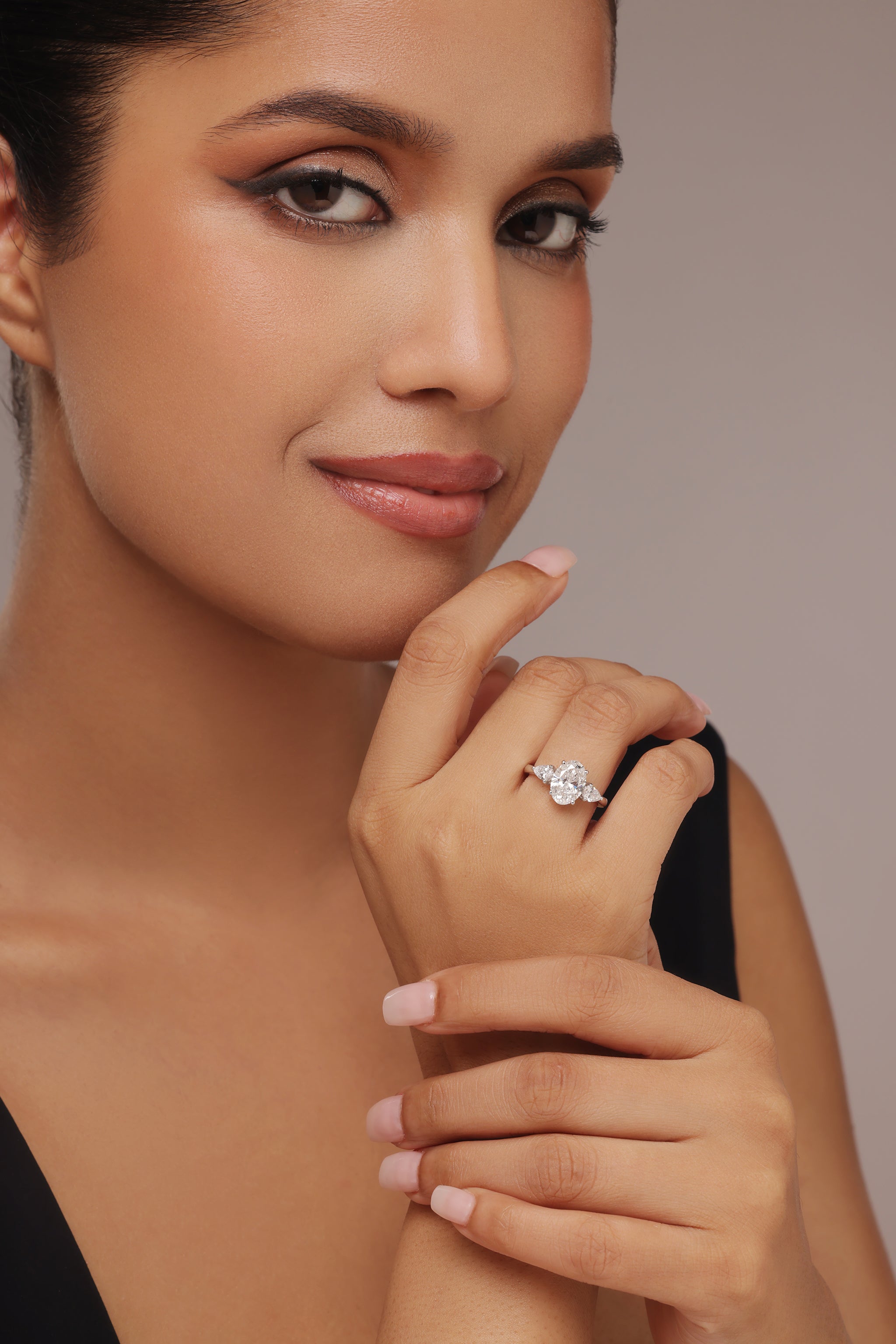 Oval-Cut Diamond Ring with pear Side Stones