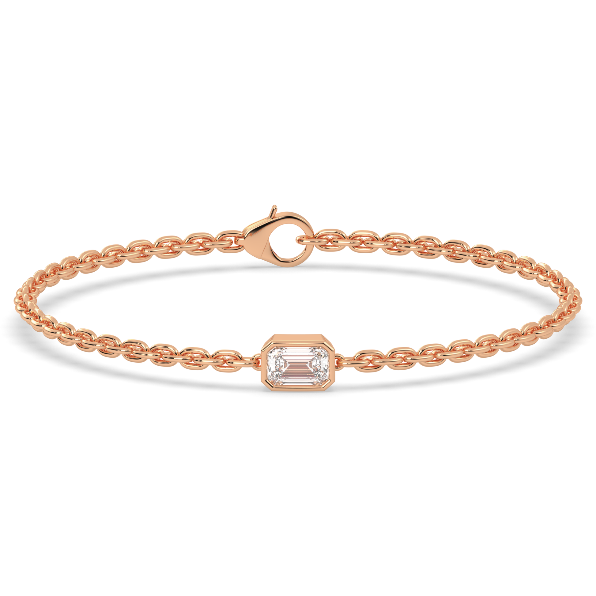 A rose gold chain bracelet with a single, horizontally set emerald cut lab grown diamond in it at the center, secured by a clasp.