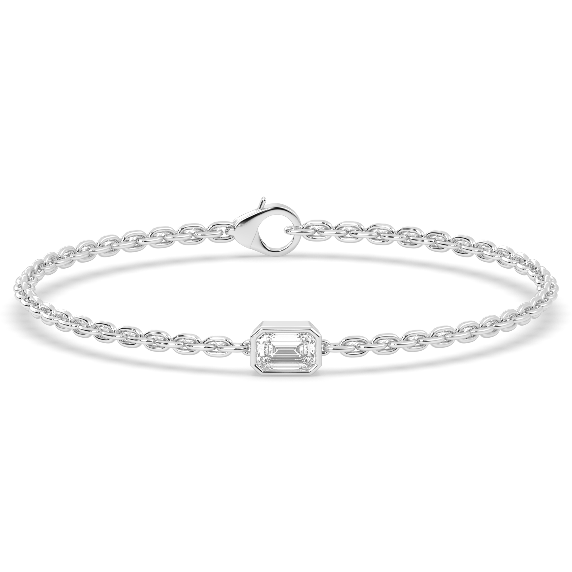 A white gold chain bracelet with a single, horizontally set emerald cut lab grown diamond in it at the center, secured by a clasp.