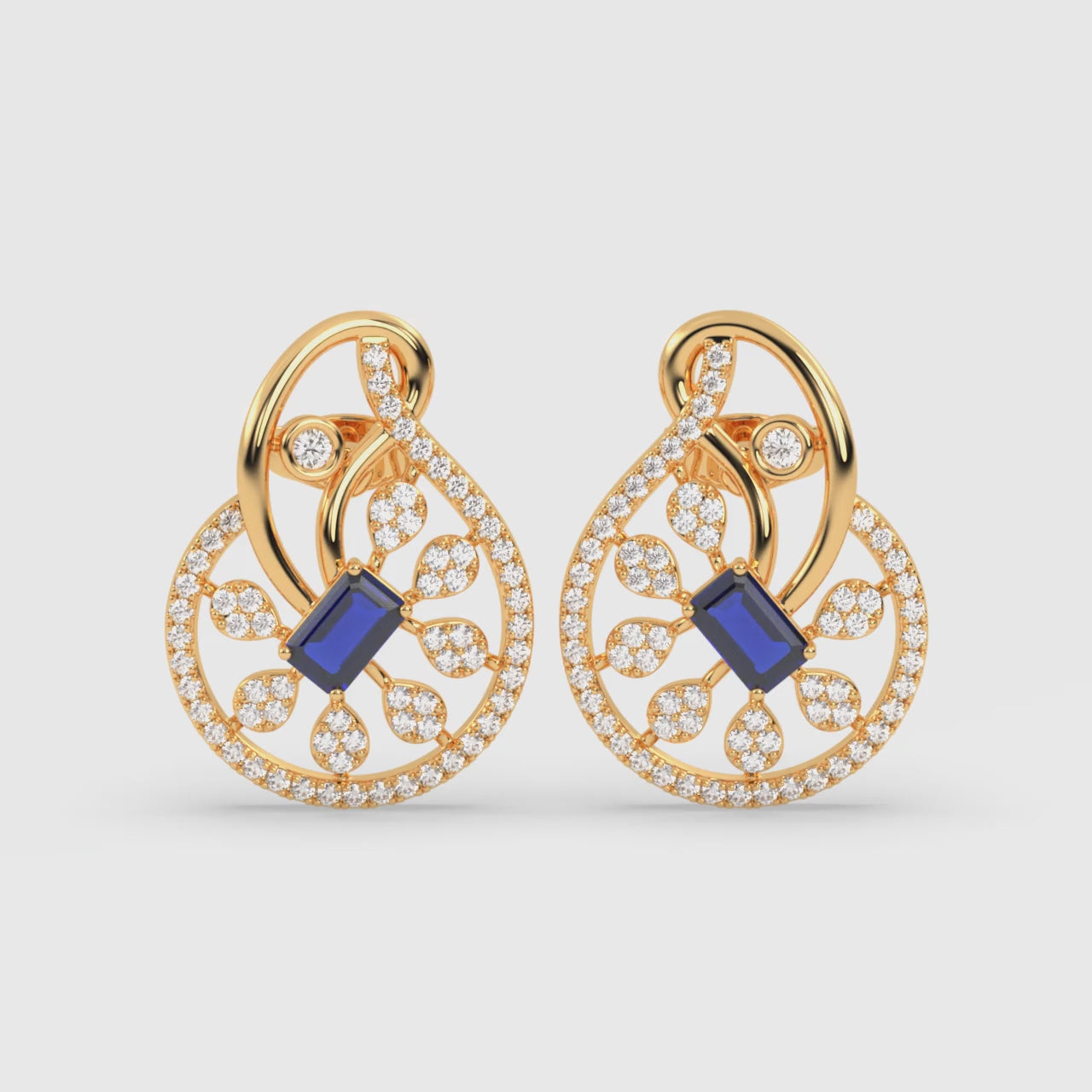 Load video: Floral Stud Earrings with Emerald-Cut Blue Sapphire