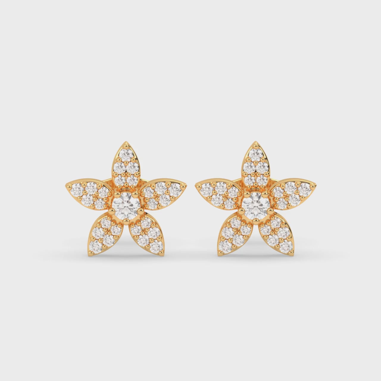 Load video: Star Cluster Earrings with Brilliant Round Diamond and Pavé Accents